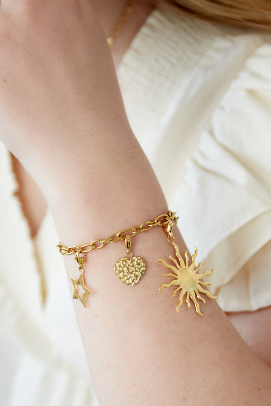 Golden sun charm bracelet with radiant pendants