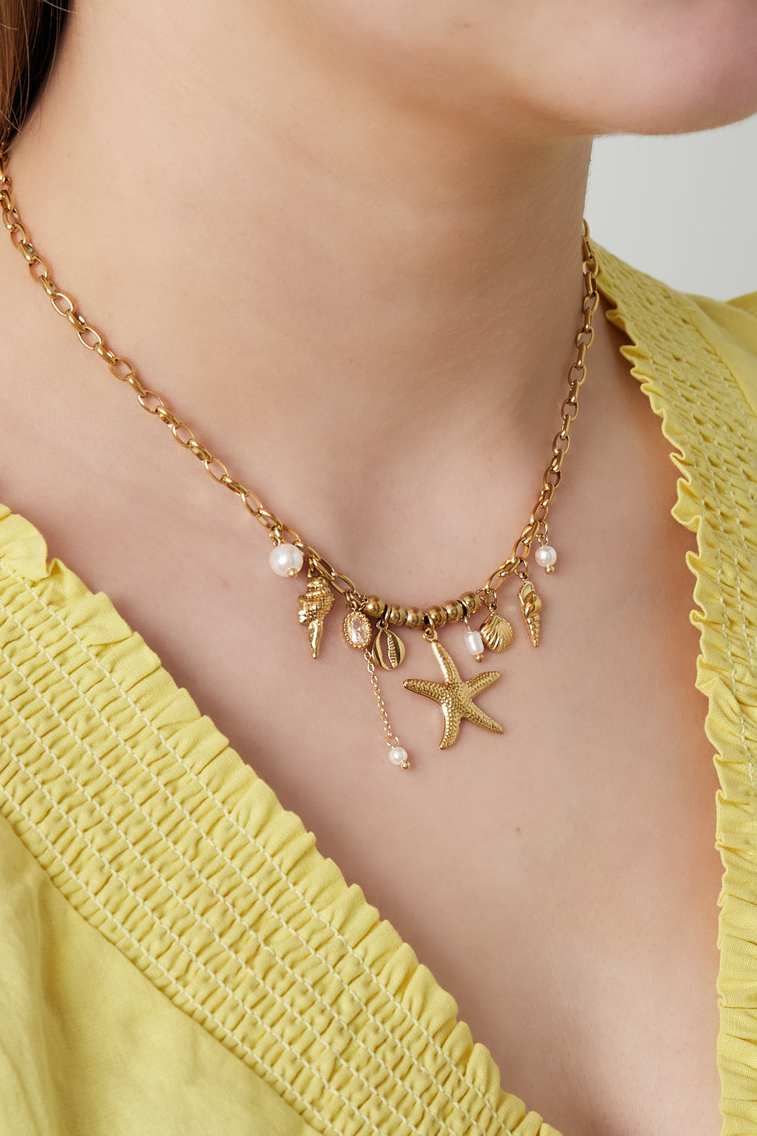 Necklace with charms and pearls