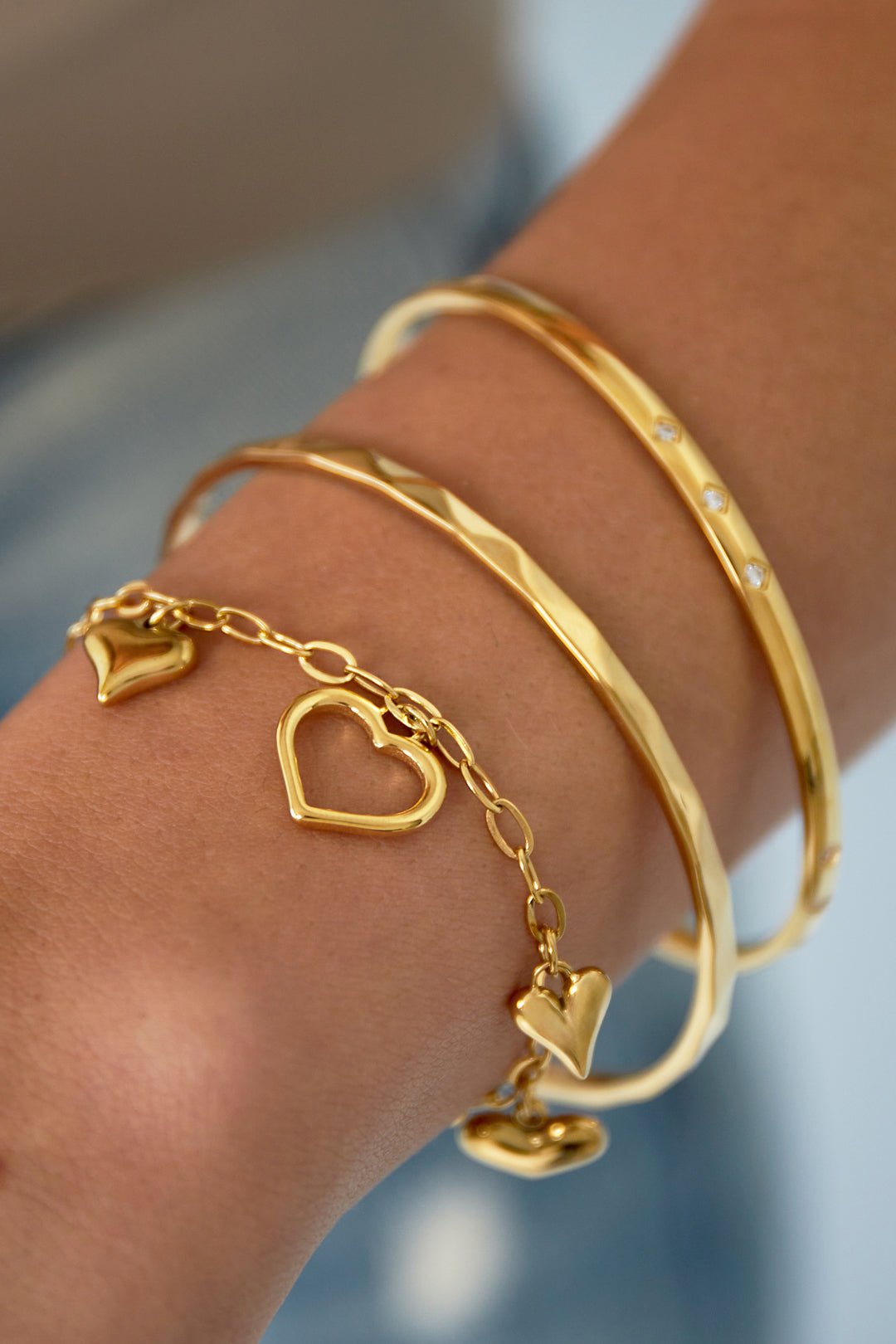 Linked hearts bracelet with mixed heart charms