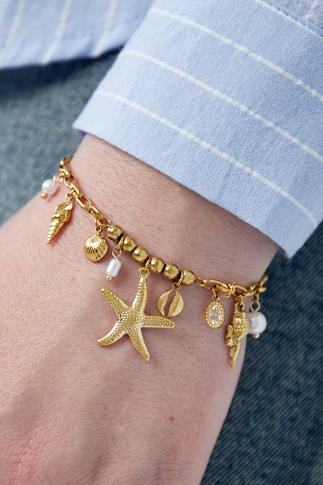 Golden beach charm bracelet with pearls & shells