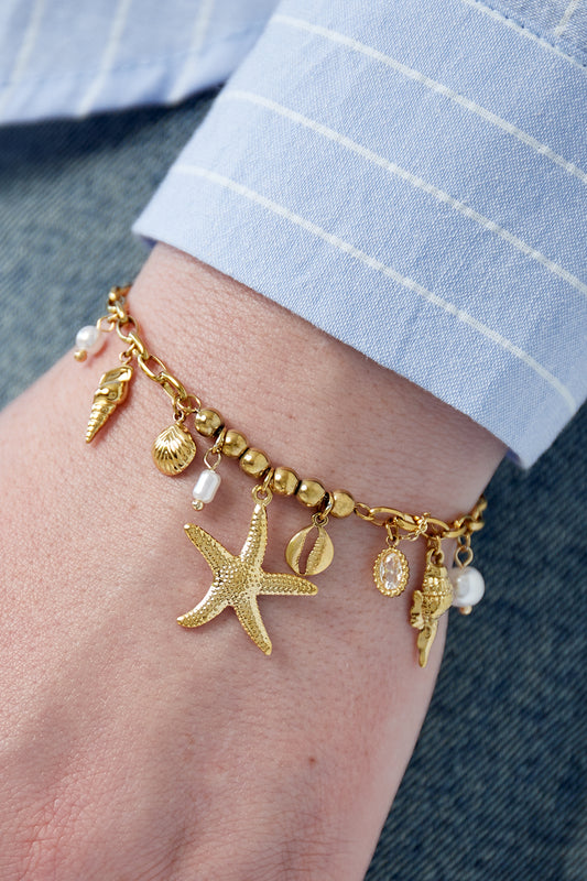 Golden beach charm bracelet with pearls & shells